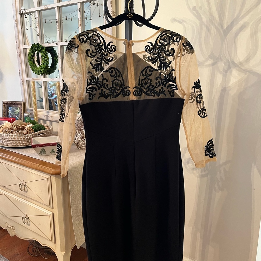 Beautiful black with illusion sleeves evening dress. Great for New Years Eve🎉